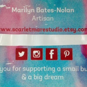 May include: A business card with a watercolor background in shades of pink, blue, and purple. The text on the card reads "Marilyn Bates-Nolan Artisan www.scarletmarestudio.etsy.com" and includes social media icons for Twitter, Instagram, Facebook, and Pinterest. The text at the bottom reads "Thank you for supporting a small business & a big dream."