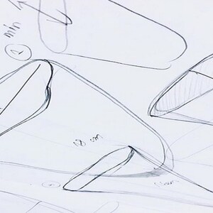 May include: Hand-drawn sketches of different shapes with measurements in centimeters and millimeters. The sketches are on a white piece of paper.