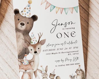 May include: A woodland-themed first birthday party invitation with a watercolor illustration of a bear, deer, fox, rabbit, squirrel, and hedgehog wearing party hats. The invitation reads "Jenson is turning ONE" and includes the date, time, and location of the party.