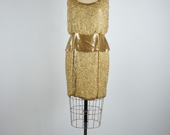 A stunning 1960s hand finished gold beaded dress by Oleg Cassini