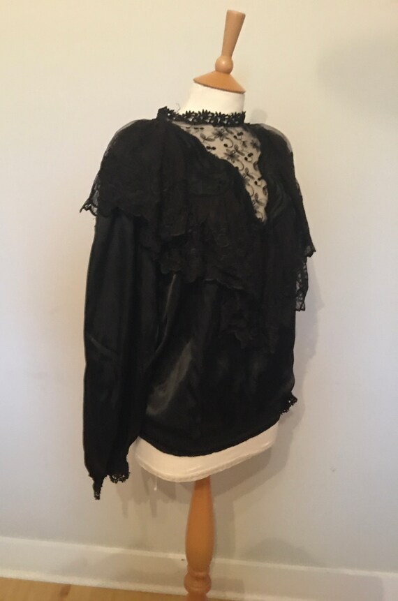 A 1980s does victorian gothic black satin blouse w