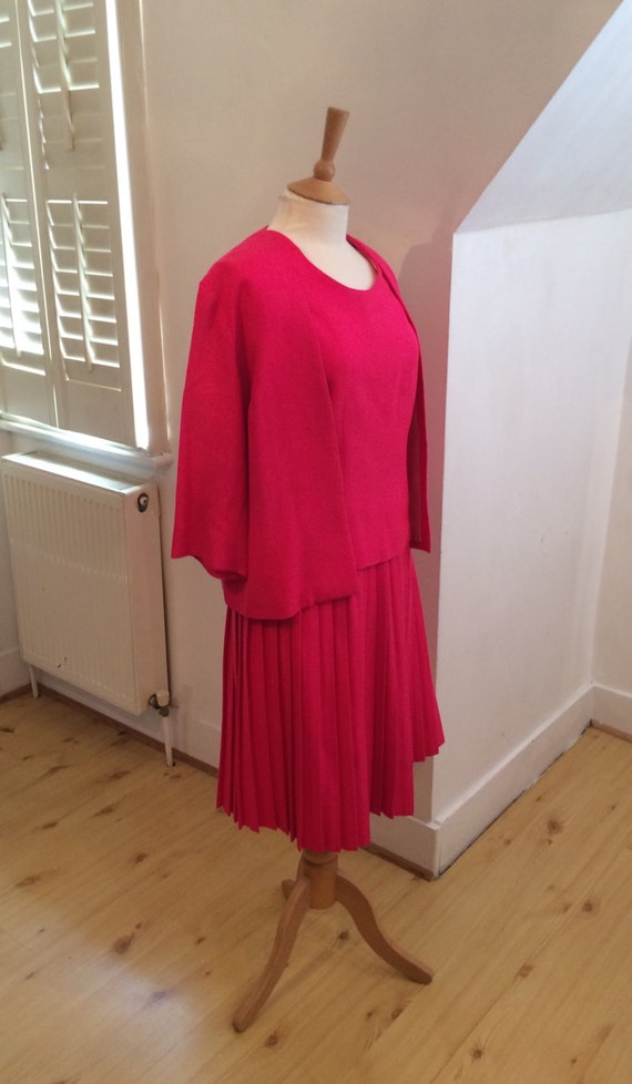 hot pink 1960s pleated skirt suit