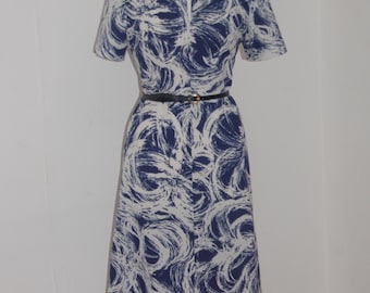 1960's Navy and white swirl pattern shift dress with short sleeves and split neckline