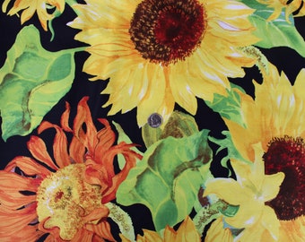 Large Sunflowers, yellow, green, brown, and black print create the Flowers of the Sun Panel by Joanne Porter for Wilmington Prints 14B 024