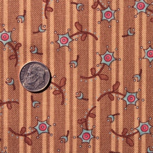 May include: Brown fabric with a repeating pattern of small blue and pink flowers with brown stems. The fabric has thin brown stripes.