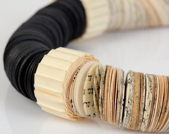 Symmetrical paper necklace  combined with shades of black and white