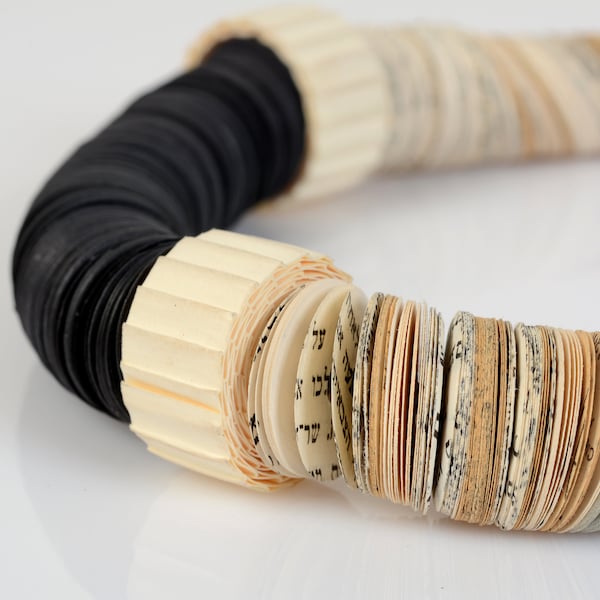 Symmetrical paper necklace  combined with shades of black and white