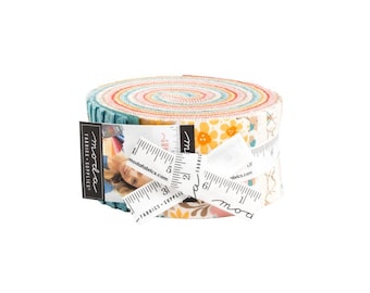 May include: A roll of fabric featuring a variety of colorful floral prints. The fabric is rolled up and tied with a ribbon. The roll is labeled "moda fabrics - supplies" and "modafabrics.com".