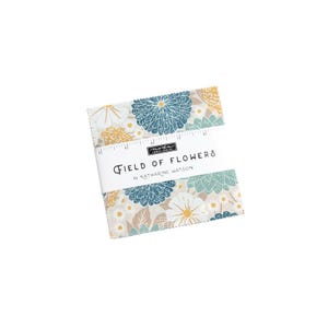 May include: A pack of fabric squares featuring a floral print in shades of blue, white, and yellow. The fabric is labeled "Field of Flowers by Katharine Watson".