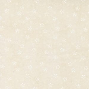 May include: A light beige fabric featuring a repeating pattern of small, white, five-petaled floral shapes scattered across the surface. The textile has a visible woven texture with a consistent, evenly spaced distribution of the white flower motifs.