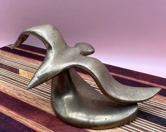 Brass MCM bird in flight