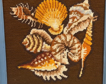 Shell crewel / embroidery/ needlepoint cross stitch.  Browns with blue frame.