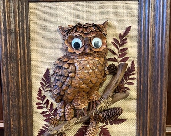 Rare Owl artwork made from pinecones and wood.  canvas or burlap background, leaves and twigs 3d.