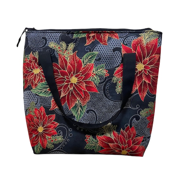 Black handbag with red Poinsettias. Fully padded with foam and lined with black cotton fabric. With zipper and interior pockets.