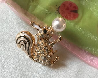 Bling Treat! Under 20 Dollars goodie this one is a Super Cute Squirrel Pin In Enamel & Rhinestone on Goldtone with a Creamy Faux Pearl