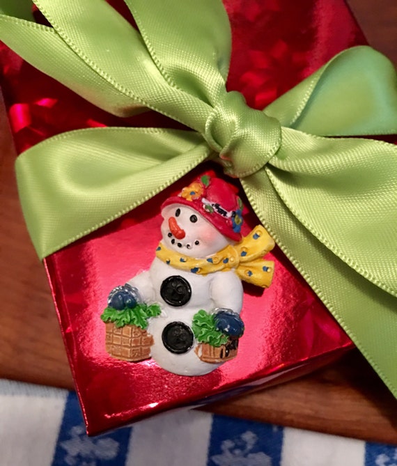 Vintage resin Christmas snowwoman in red hat  by Carol Eldridge comes gifted nicely