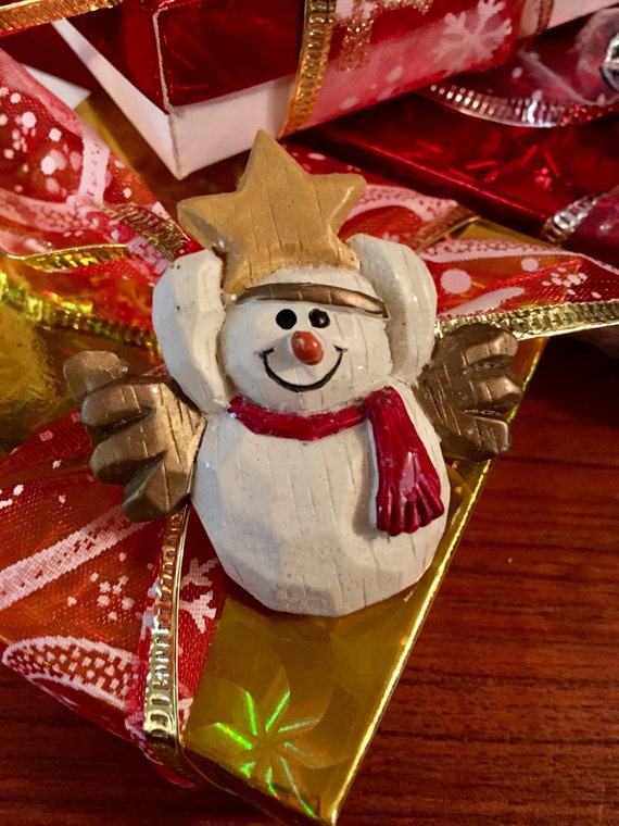 Vintage Christmas snowman holding a star pin comes giftboxed & ribboned