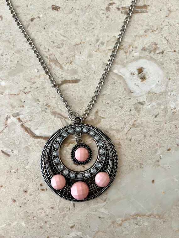 Vintage 90s Southwestern Glam Pendant: Pink Tribal Medallion Necklace with Faux Angel Skin and Rhinestones