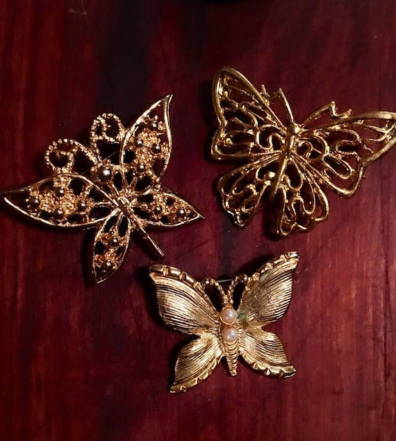 Grouping of Threes golden butterfly vintage brooches