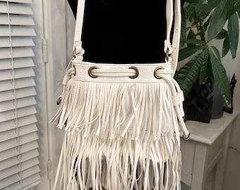 Carlos Santana Fringed Bucket Bag: White Faux Leather Crossbody