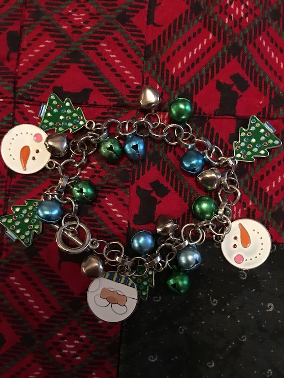 Vintage Christmas holiday charm bracelet with jingle bells & enamel snowmen and christmas trees