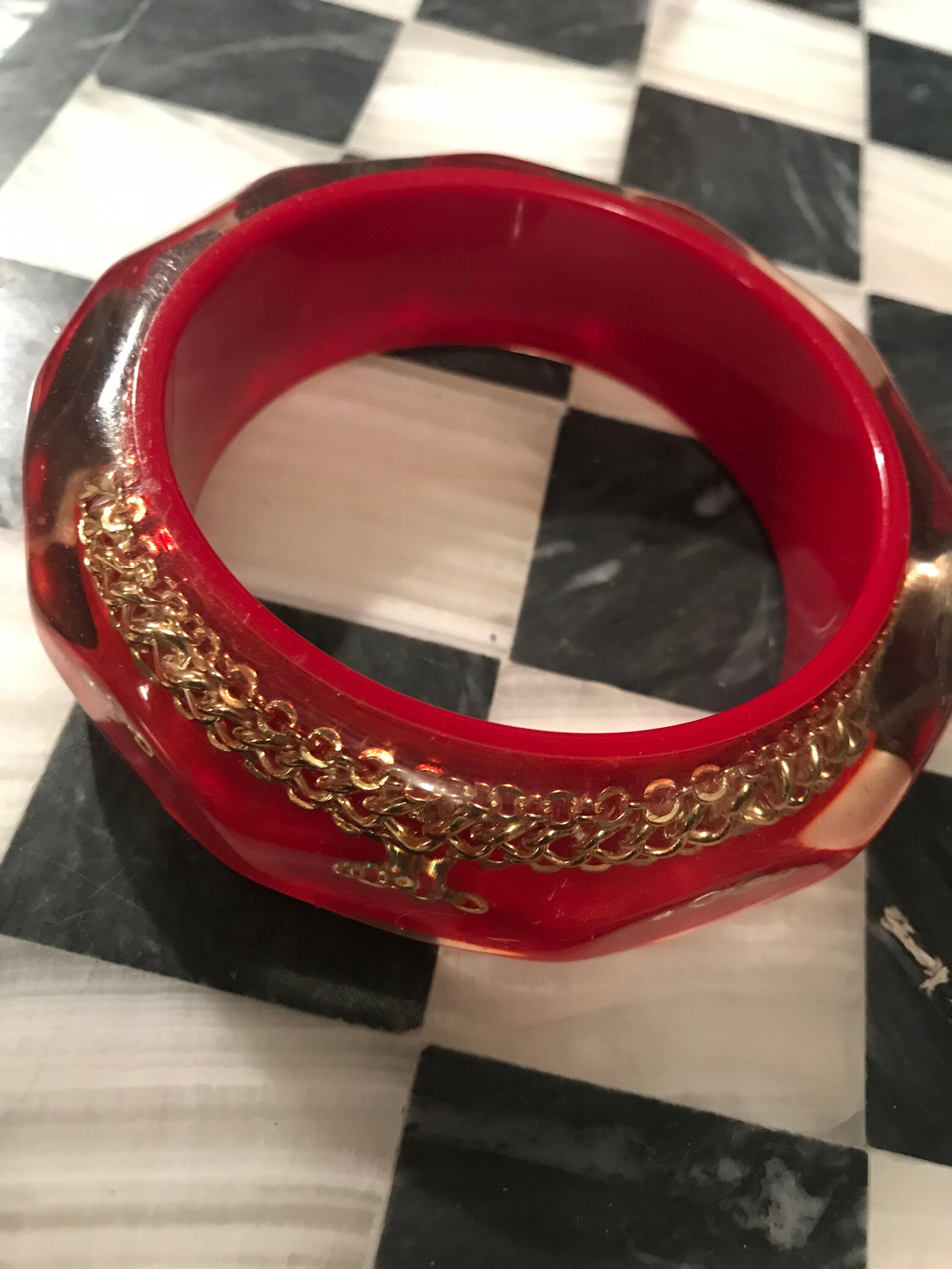 Chunky Glass like Lucite Bangle with Chain center & Red Background, Big ...