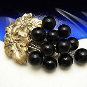 antique art nouveau black onyx grapes and brass dress clip