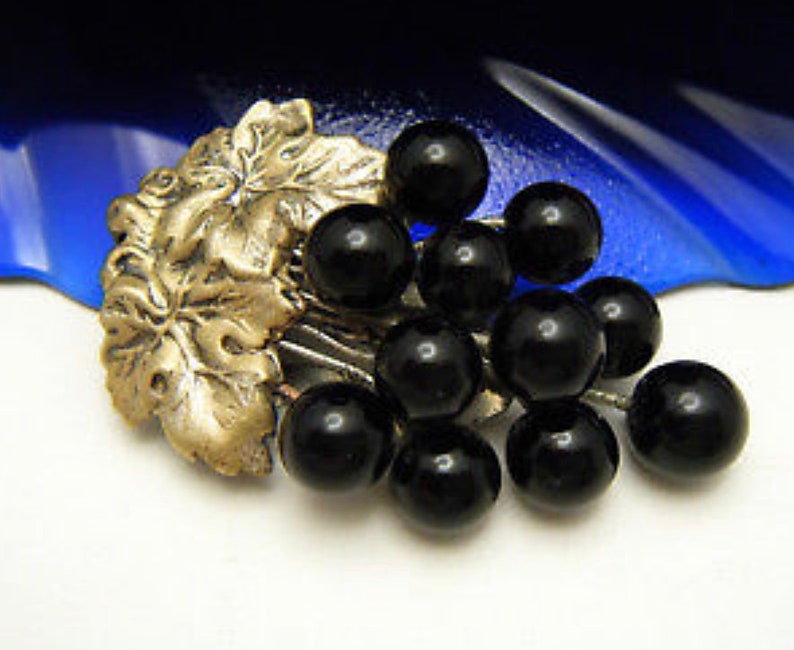 antique art nouveau black onyx grapes and brass dress clip
