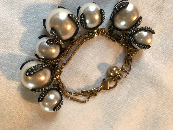 Dramatic Link Bracelet of Oversized Pearls Set in Rhinestoned Japanned Black Drippy Claw like Settings with goldtone chain.