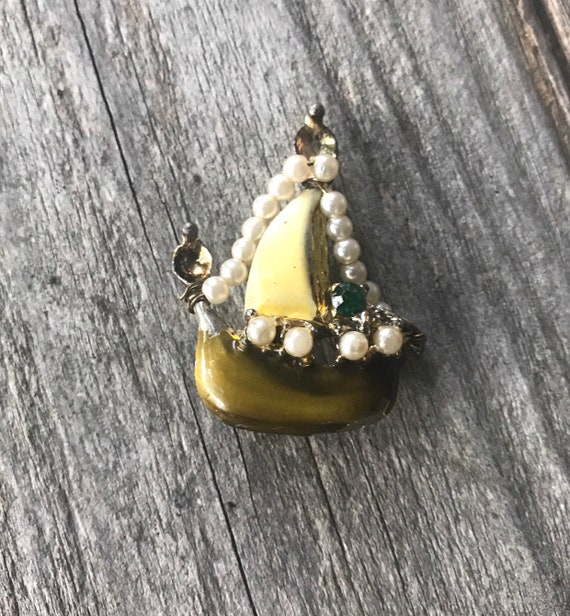 A Tiny very old Enameled Viking Ship Boat Lapel Pin with Pearl Sails & emeral colored gem wheel