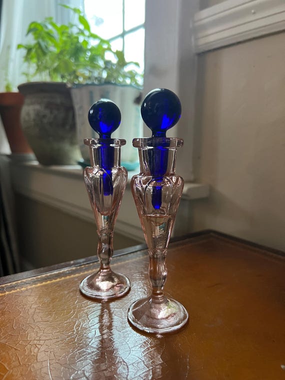 Pair of Vintage Pink Glass Vanity Bottles with Cobalt Blue Stoppers