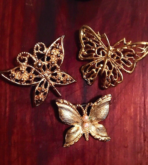 Grouping of Threes golden butterfly vintage brooches