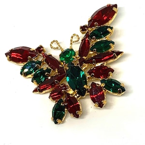 Vintage Rhinestone Butterfly Brooch with Wings of Ruby Red and Emerald Green Navette Crystal Gems Set in an Ornate Shiny Goldtone Pin