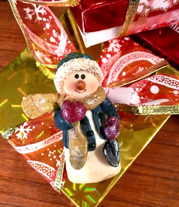 Vintage resin sparkly Christmas snowman holding a snow shovel comes giftboxed & ribboned