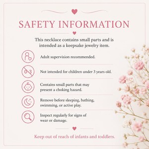 May include: A light pink card with the text "SAFETY INFORMATION" and safety guidelines for a necklace. The card advises adult supervision, is not for children under 3, and contains choking hazard warnings. It also recommends removing the necklace before sleeping or swimming.