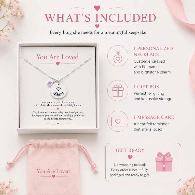 May include: A silver necklace with a personalized pendant and a purple gemstone, presented in a gift box with a message card. The text on the pendant says "Ashley". The image also includes a pink gift bag that says "You Are Loved".
