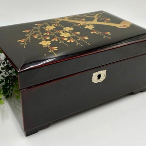 Vintage Asian Lacquerware Musical Jewelry Box | Black Lacquer Hinged Box with Flowering Branch Design | Chrome Hardware | Red Fabric Lining
