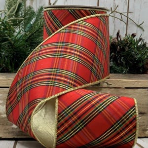 May include: Red and green tartan ribbon with gold trim. The ribbon is 2.5 inches wide and has a wired edge.