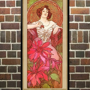 May include: Framed vintage art print featuring a woman in a flowing gown with large red flowers. The artwork has a decorative circular design in the background and is framed in black. The text at the bottom reads "Frame for example ONLY. Item is sold UNFRAMED".