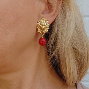 Gold Lion Head Statement Clip on Earrings with Red Bead Drop, Vintage-Inspired Jewelry, Elegant Clip Earrings, Vintage Baroque Inspiration,