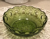 Small vintage green glass bowl. Moon and stars pattern