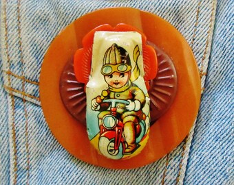 Large OOAK Old Fashioned Child on a Scooter Vintage Tin Clicker Brooch