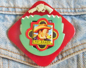 Vintage Tin Cowboy on Plastic Buckles