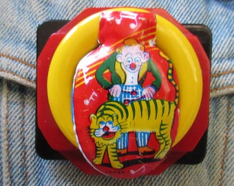 Original One-of-a-kind Brooch with Vintage Tin Clicker of Clown Playing on Tiger as a  Xylophone -  Funky, Retro Look!