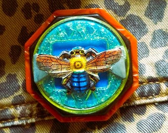 Vintage Brooch with Plastic Buckles and a Tin Moth