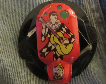 Vintage Harlequin Tin Clicker Brooch