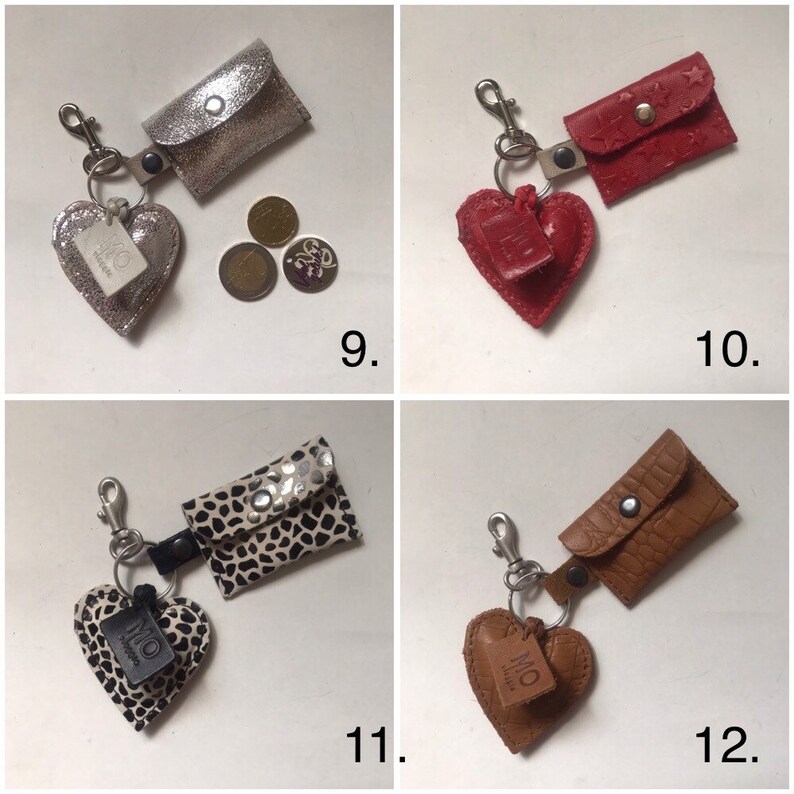 May include: Four keychains featuring a small rectangular pouch with a snap closure and a heart-shaped charm. The designs include silver glitter, red with star embossing, black and white animal print, and brown crocodile-textured leather.