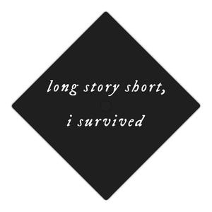May include: Black graduation cap with the text "long story short, i survived" in white.