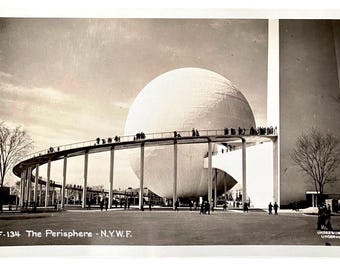 May include: Vintage black and white postcard of the Perisphere at the 1939 New York World's Fair. The spherical structure is connected to a curved walkway supported by pillars. The postcard has the text "5F-134 The Perisphere - N.Y.W.F."