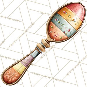 May include: A decorative wooden spoon with a colourful, striped design. The spoon's bowl features red, blue, and yellow stripes with small, round embellishments. The handle is adorned with a detailed, carved design and the text "CRAFTY MAMA CREATORS".